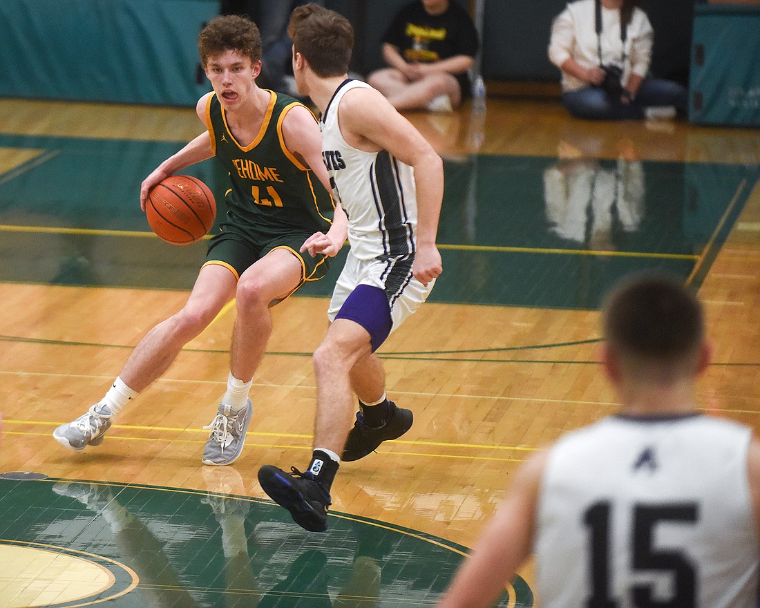 Sehome's Grant Kepley dribbles down the court Feb. 18 during The Mariners' 55-45 loss to Anacortes in the 2A District 1 championship.