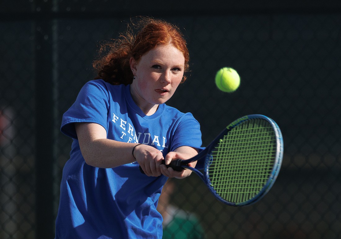 Ferndale's Jordan Childs watches her shot April 26, 2022, as Sehome took on Ferndale in a girls tennis match.