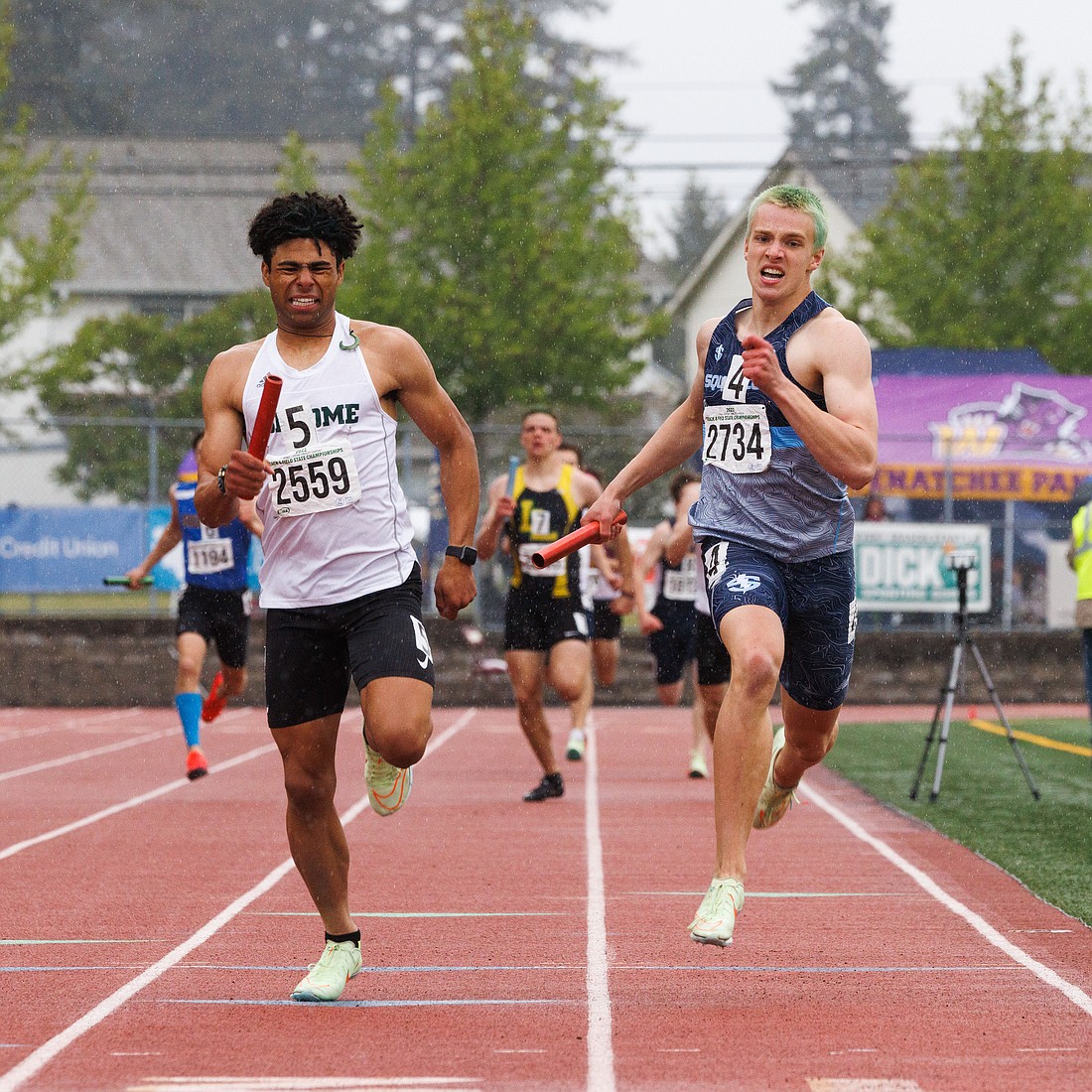 Sehome's Jake Andrews and Squalicum's Andre Korbmacher run to the finish of the boys 4x400 meter relay May 28, 2022, during the 2A state track championships in Tacoma.