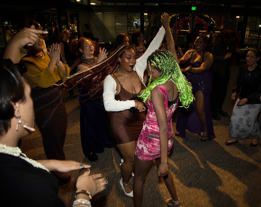 Zen Quashie, left, and Tima Deen  dance Feb. 25 at the Black Student Coalition's Legacy Ball at the Bellingham Cruise Terminal. The Western Washington University group celebrated Black History Month.