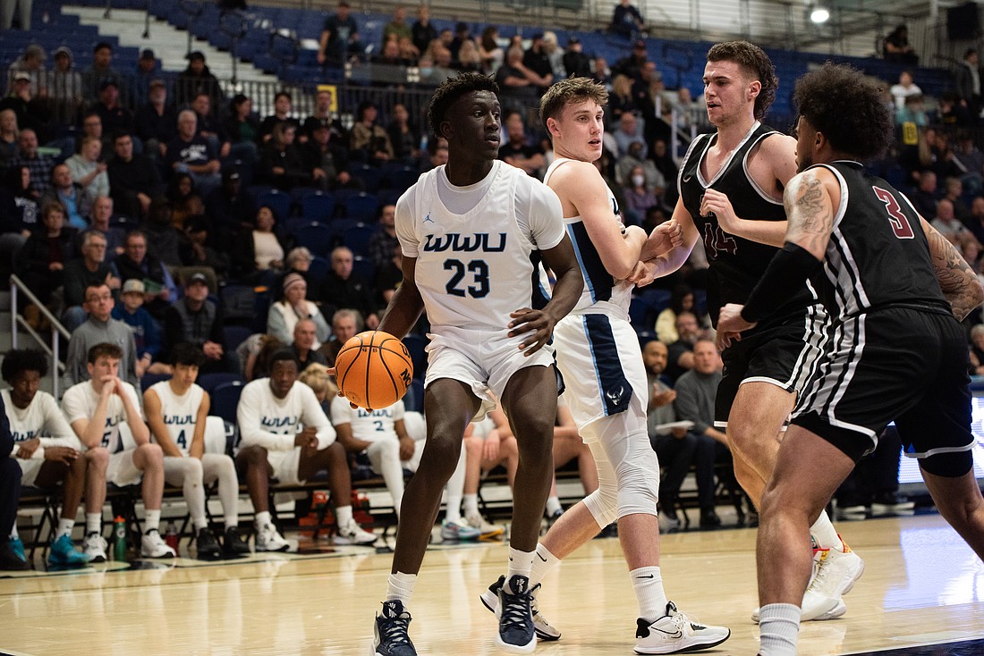Western Washington University freshman forward BJ Kolly looks to pass the ball during a 90-73 loss Jan. 7 against Seattle Pacific University. Kolly was selected as the Great Northwest Athletic Conference Freshman of the Year, Western Athletics announced Feb. 28.