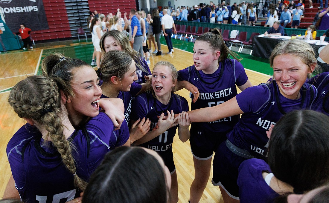 Nooksack Valley players celebrate their 43-36 win over Lynden Christian in the 1A state championship game March 4 at the Yakima Valley SunDome.