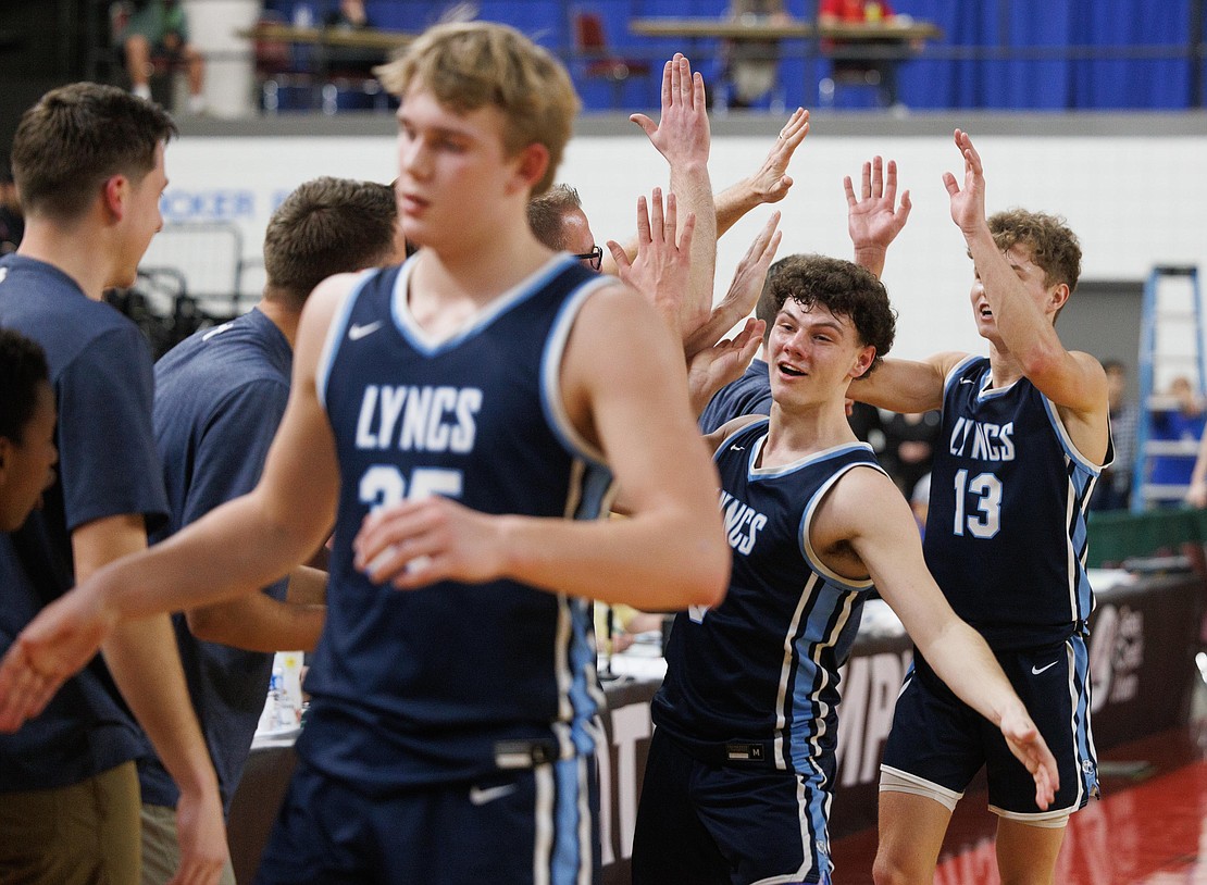 Starting players head to the bench as the clock ticks down to the end of the game as Lynden Christian beat King’s in the 1A state championship game.