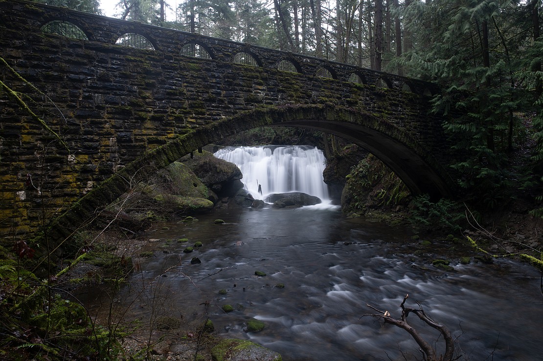 Water flows under the Depression-era stone bridge Feb. 20 in Whatcom Falls Park.