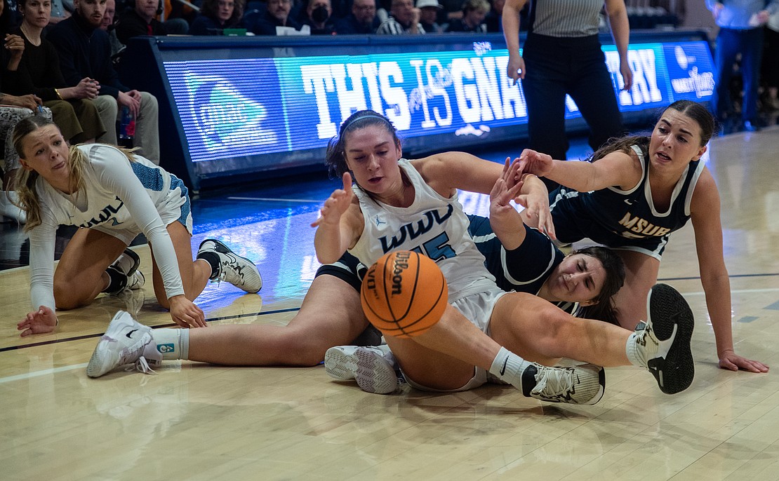 Western's Brooke Walling falls to the floor reaching for a loose ball.