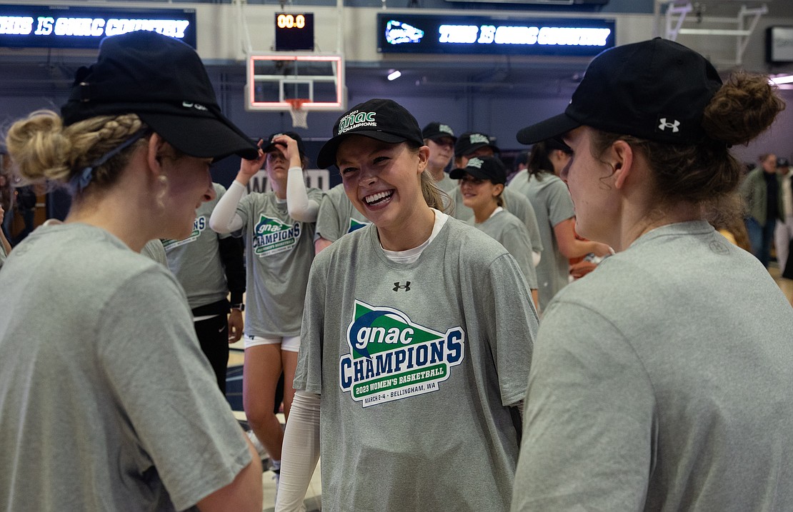 Avery Dykstra smiles after putting on GNAC championship gear.