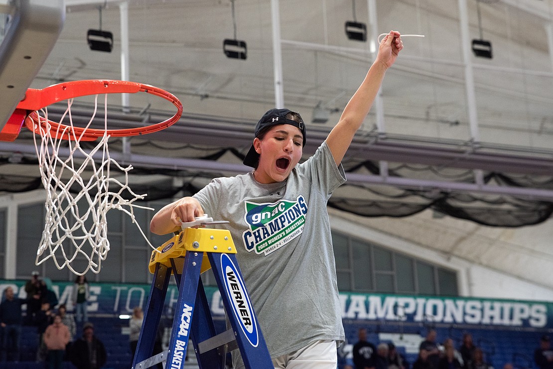 Mason Oberg holds up her piece of the net.
