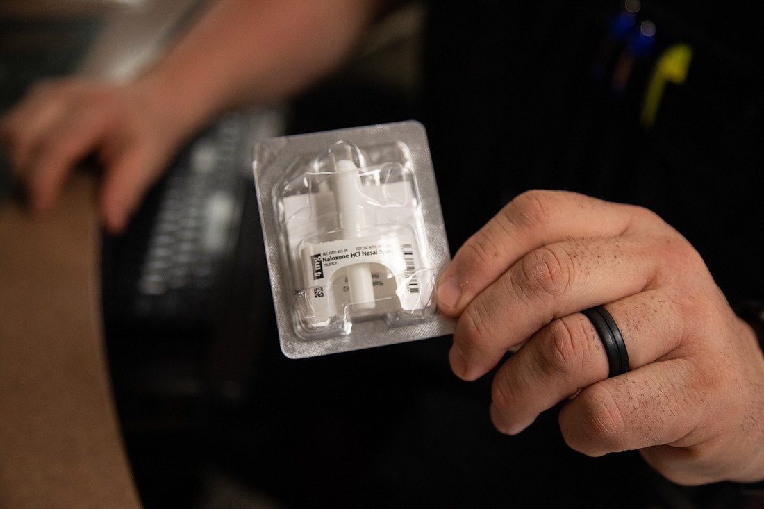 A Whatcom County corrections officer holds a packet of Narcan to treat narcotic overdoses. Officers carry them in pockets and stash them around the jail, so they're easily accessible if and when they need them.
