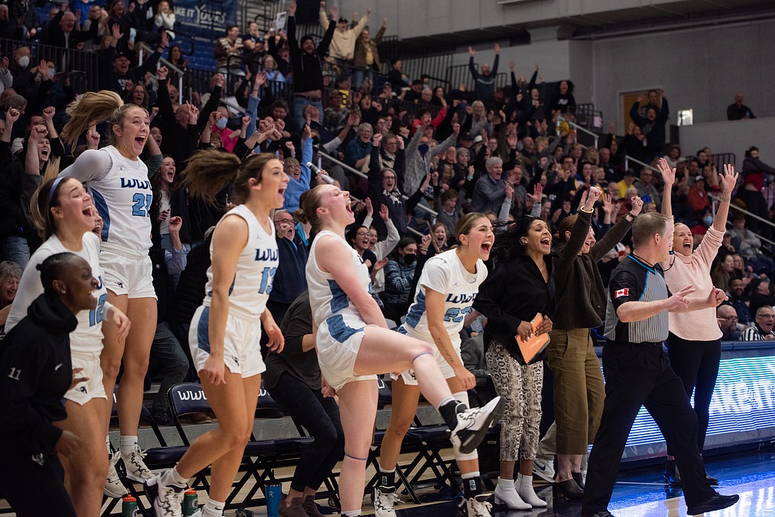 Western's bench cheers after the Vikings scored against Montana State University Billings in a 76-71 win of the Great Northwest Athletic Conference championship game at Carver Gymnasium March 4.