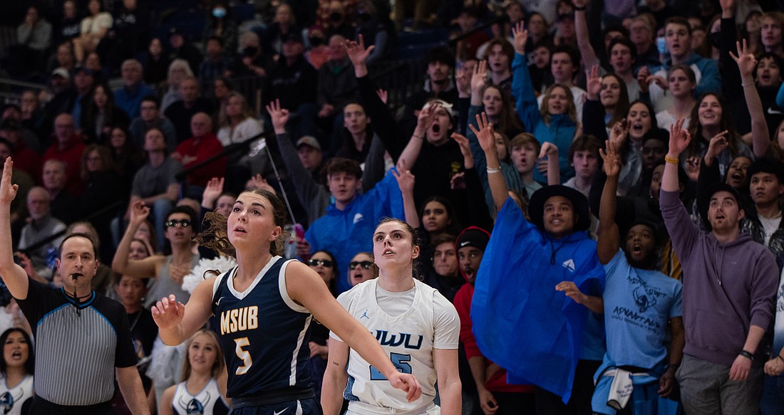 Western fans react as Maddy Grandbois hits a 3-pointer March 4 during the Vikings' 76-71 win over Montana State University Billings in the GNAC Championship game.