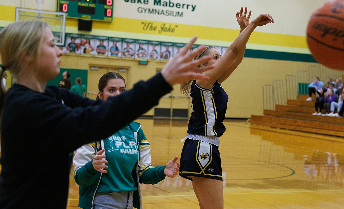 As volunteers pass balls to her, Ferndale's Cailyn Kessen competes in the 3-point contest.