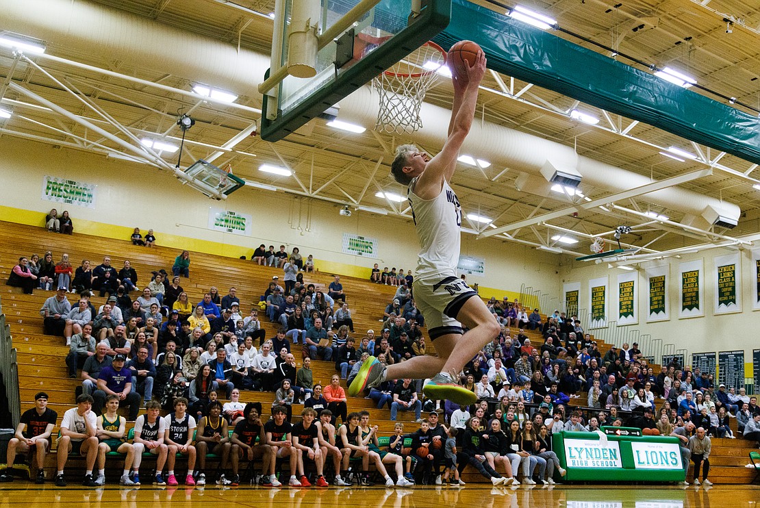 Nooksack Valley's Ayden Roper goes up for a reverse jam during the dunk contest.