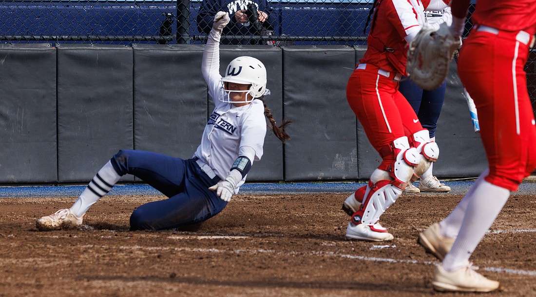 Western Washington University’s Taylor Khorrami slides in for a run March 11 as Western Washington University beat Simon Fraser University 2-1 in the first game of a doubleheader.
