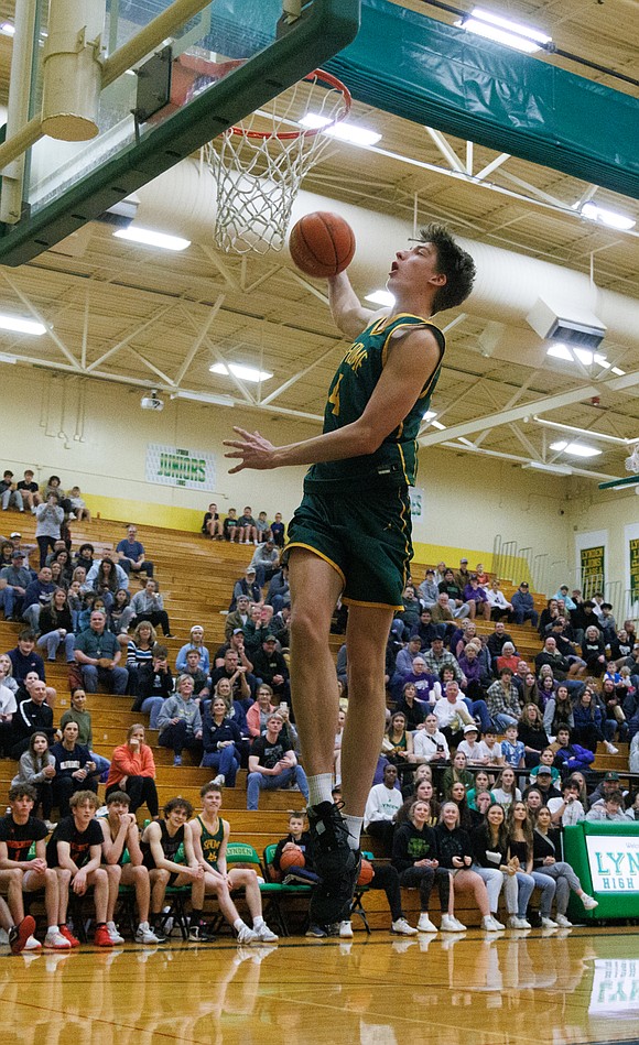 Sehome's Grey Garrison dunks the ball during the dunk contest.