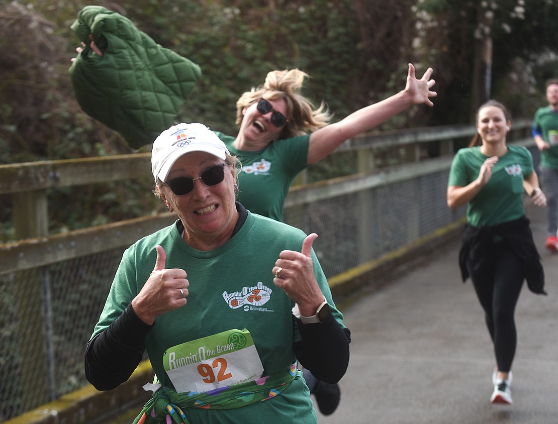 Janice Fryatt puts her thumbs up while participating in the 5K race.