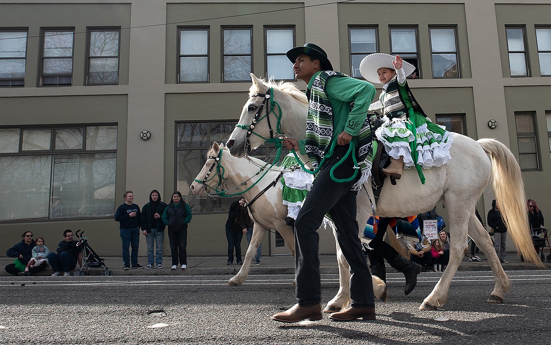 Antonio Florentino and Diana Florentino of the Skagit Latin Horse Association participate in the St. Patrick's Parade.