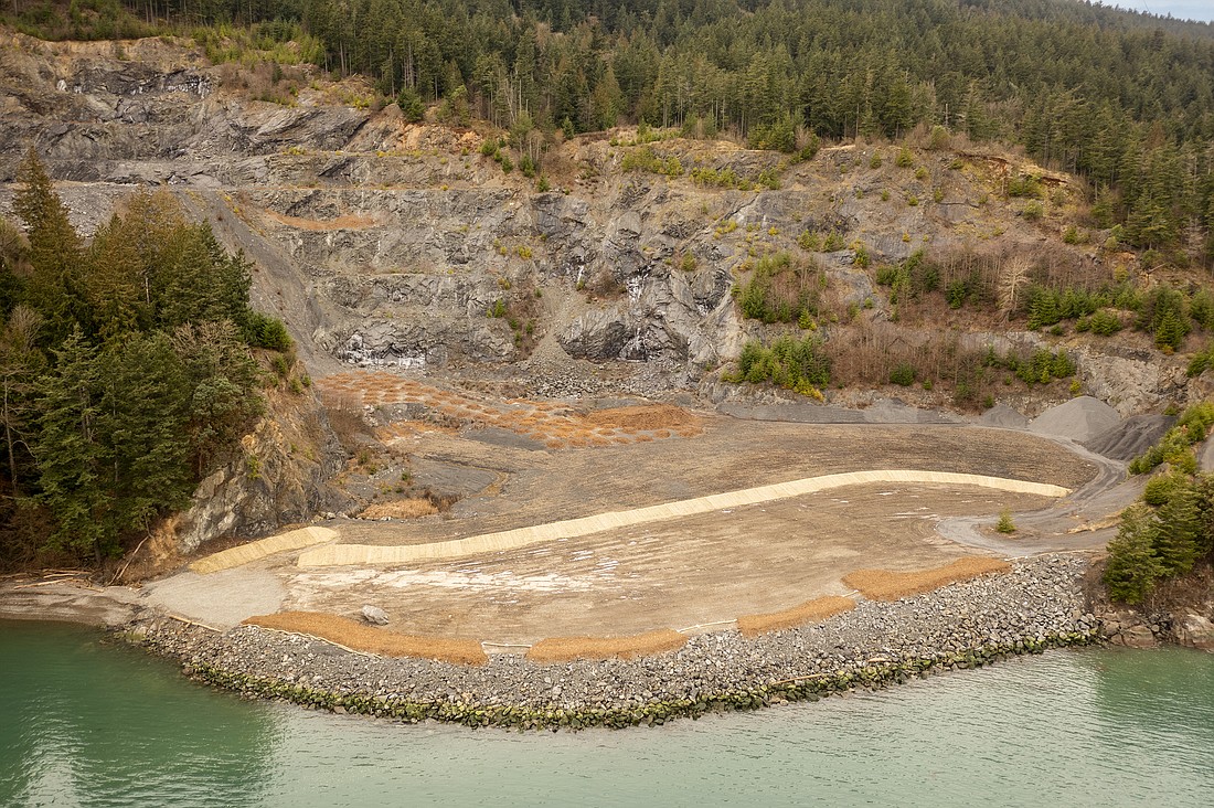 The Lummi Island Heritage Trust has been working to restore land in and around an old gravel mine since 2015. Now, the group will plant more than 800 trees and bushes in the mine floor to turn it into a forest.