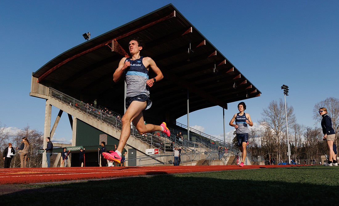 Squalicum's Tyler Nielsen leads teammate Wesley Sluys in the 1,600-meter run March 16, finishing first and second against Bellingham and Sehome at Civic Stadium.