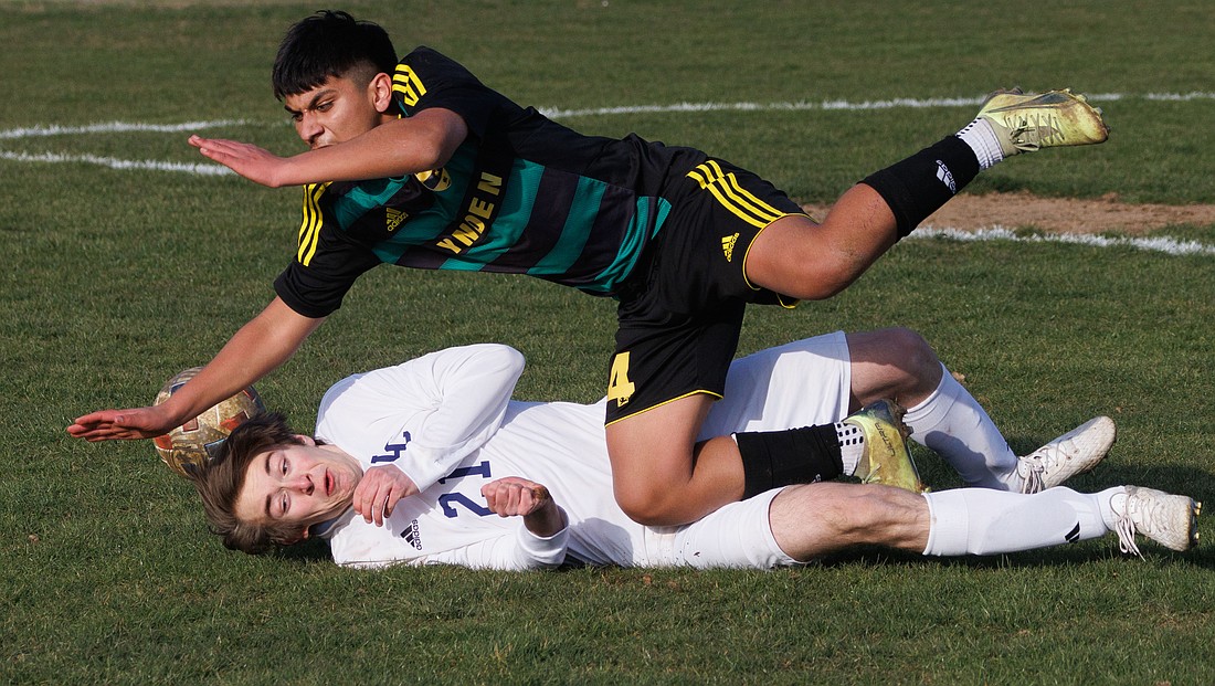 Lynden's Victor Huaracha and Lynden Christian's James Creydt collide in the second half March 16 during a 1-1 tie between the two teams at Bender Fields.