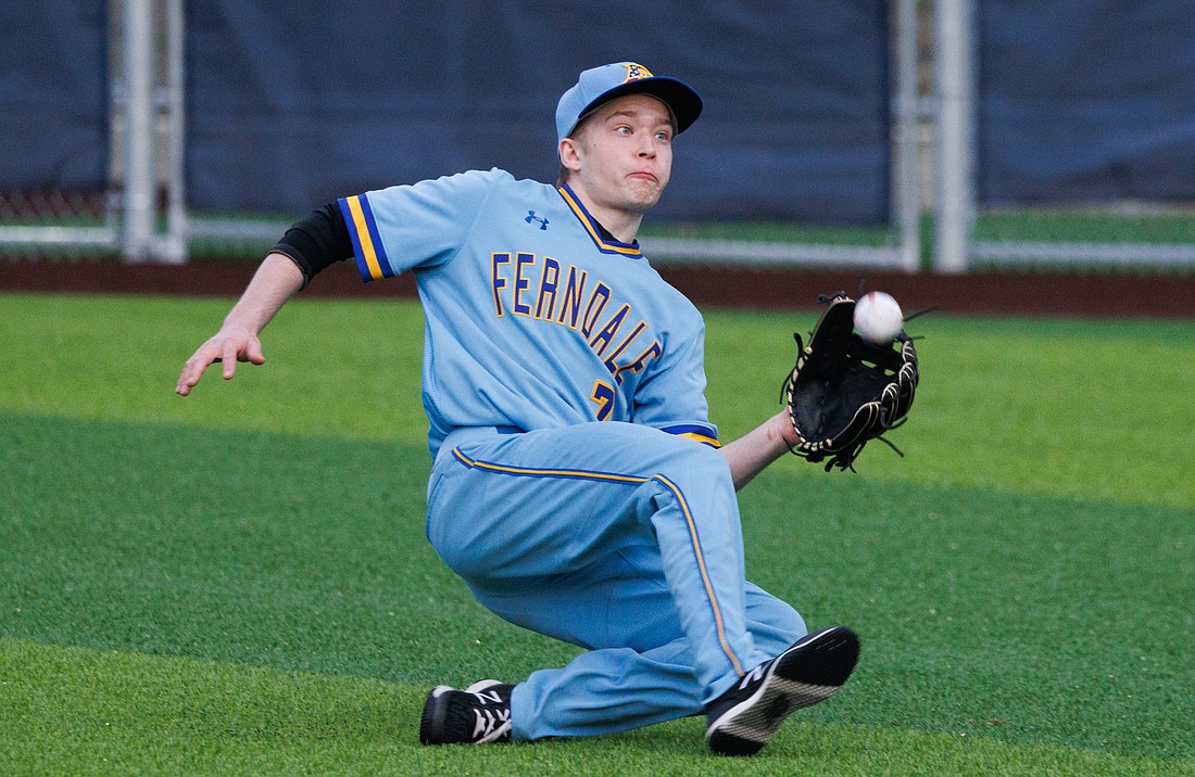 Ferndale's Tipton Bundy makes a sliding catch in the outfield March 17 as the Golden Eagles beat Squalicum 9-3 in Bellingham.