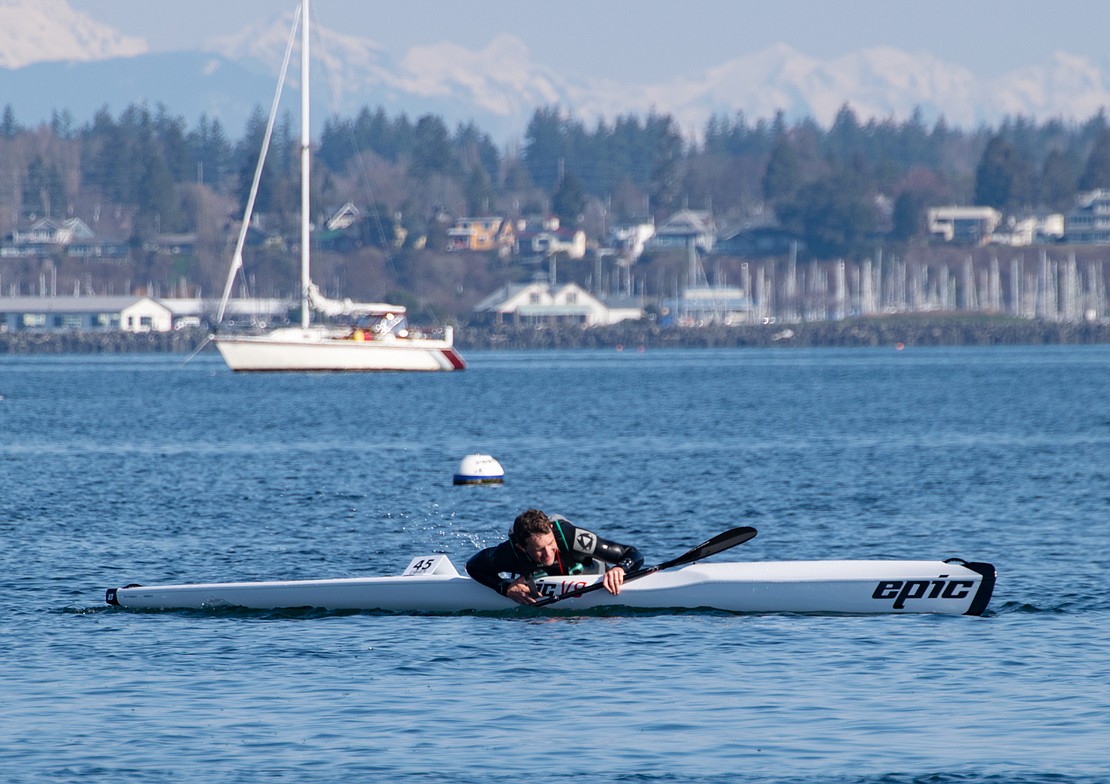 Phil Midler climbs back into his surfski after tipping right before crossing the finish line.