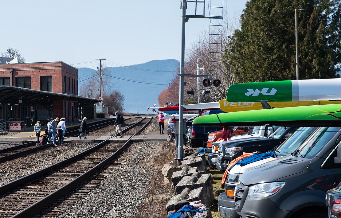 Cars holding watercraft fill the Community Boating Center parking lot.