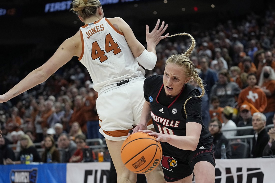 Louisville guard Hailey Van Lith (10), a graduate of Cashmere High School near Wenatchee, drives around Texas forward Taylor Jones (44) during the first half of a second-round college basketball game in the NCAA Tournament in Austin, Texas, March 20. Van Lith is one of two Washington state players coming "home" to compete in West Regional play at Seattle's Climate Pledge Arena beginning Friday.