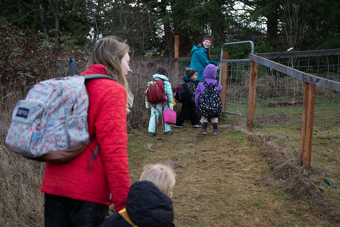 Teacher Katy Mullen leads students to their classroom at Barefeet Farm School in February. Child care centers received a $4.5 million funding boost from the Whatcom County Council on March 21.