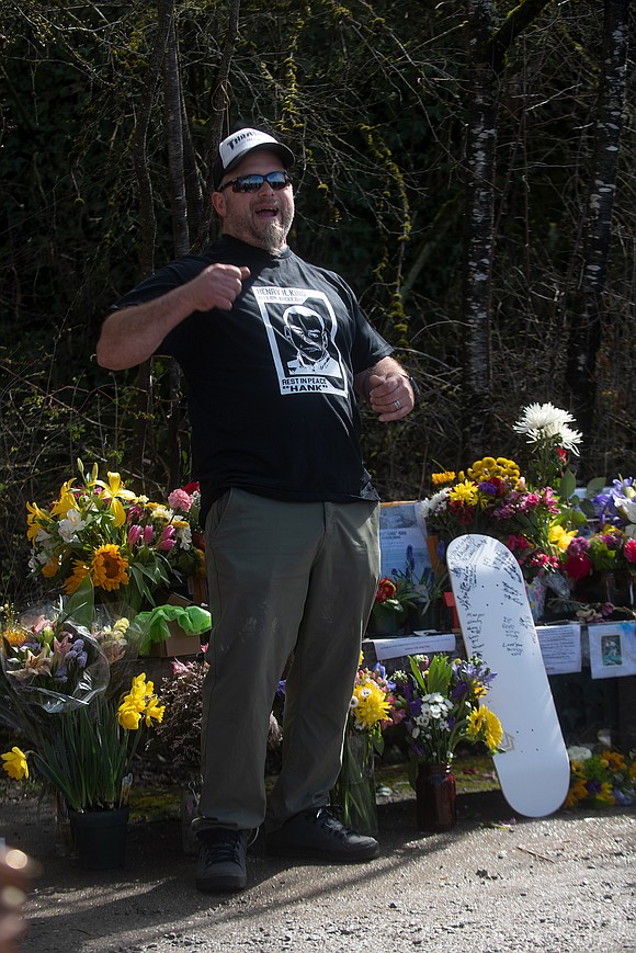Marcus Souza tells a story about childhood friend Henry King during a celebration of life ceremony near Taylor Dock.