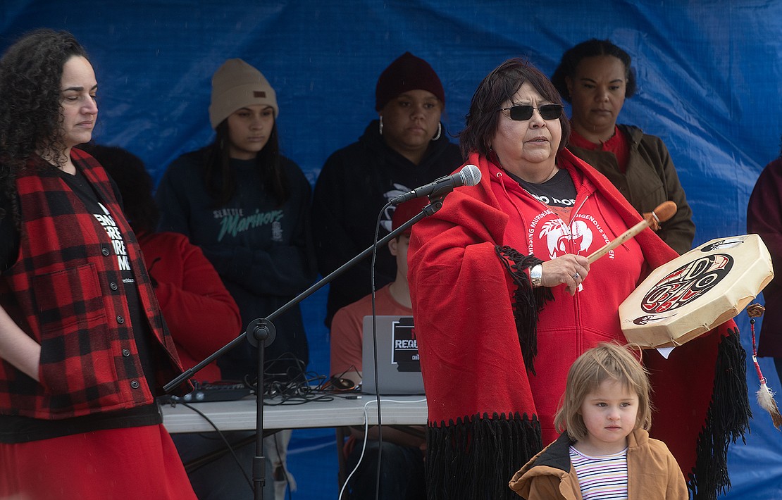 Charlene Casimir of the Lummi Nation drums and prays during the No More Stolen Sisters rally for missing and murdered Indigenous women March 25 at Maritime Heritage Park in Bellingham.