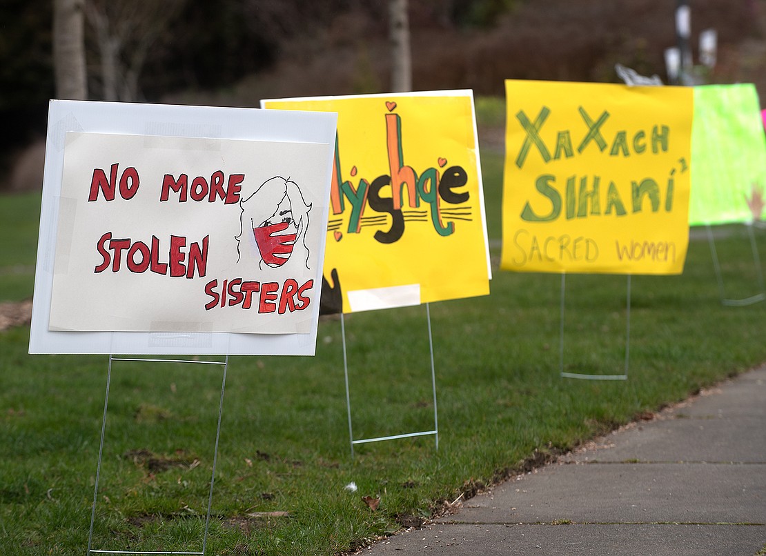 No More Stolen Sisters signs line the sidewalk during Women's History Month at Maritime Heritage Park.