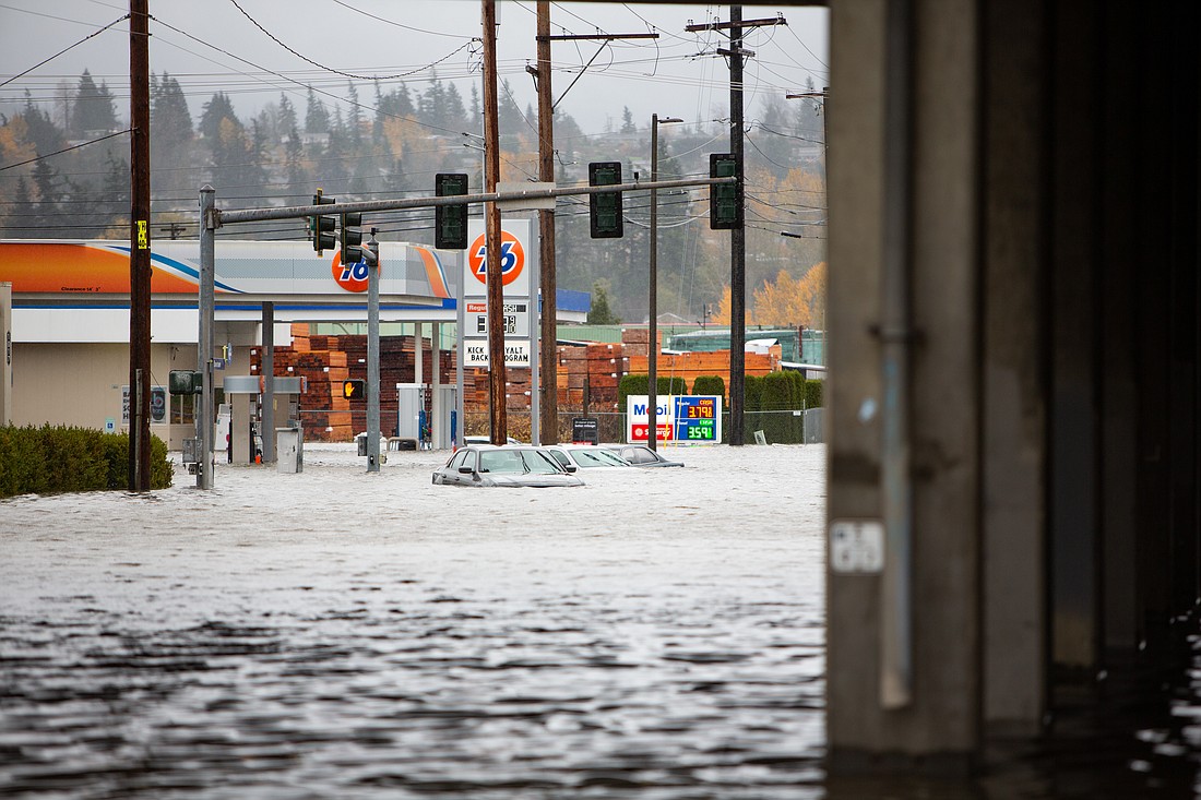 Water floods Iowa Street below Interstate 5 in Bellingham in November 2021. A Washington state House bill would establish a state emergency medical reserve corps. The network of volunteers could be deployed to respond to natural disasters, public health emergencies and more.