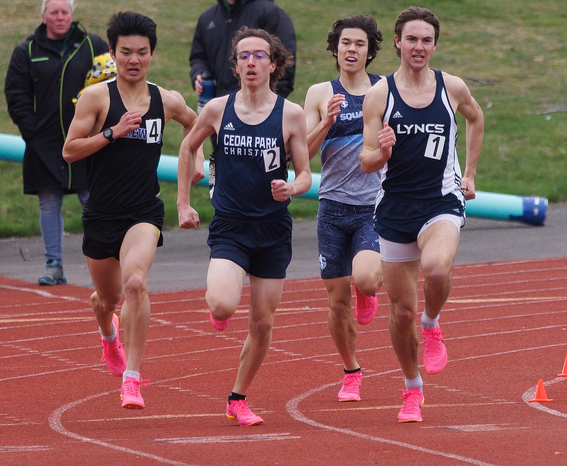 Lynden Christian's Andrew Luce, right, tries to hold onto his lead in the boys 800-meter run. Luce finished third. Squalicum’s Wesley Sluys took second.