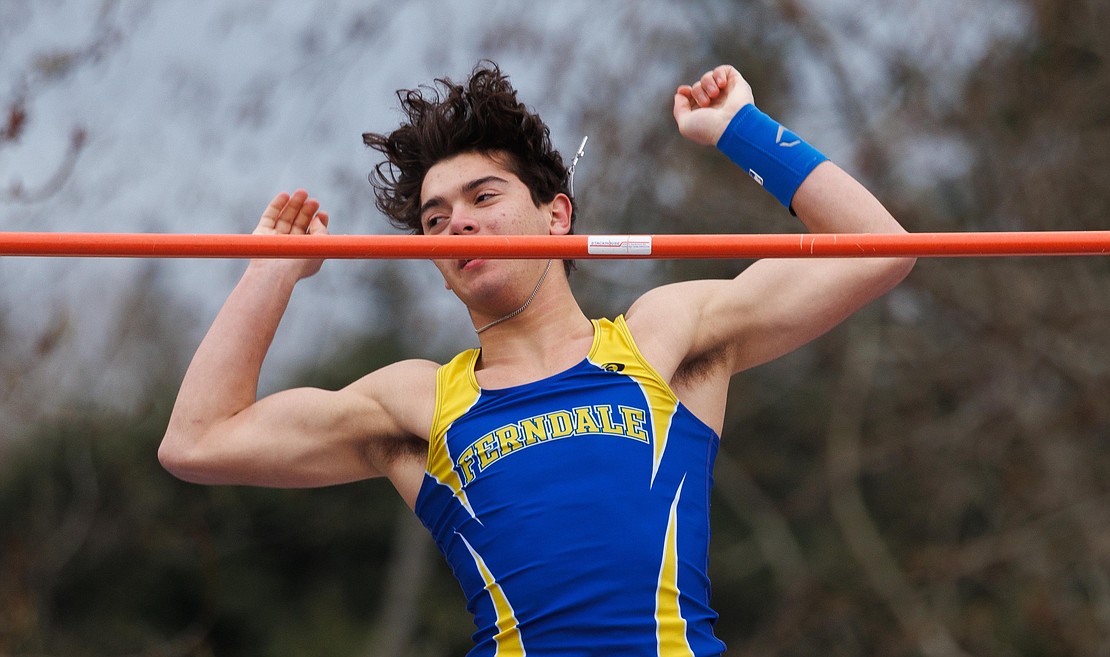 Ferndale's Adrian Finsrud watches the bar as he clears 12 feet in the boys pole vault. Finsrud tied for first place with his brother, Andrew Finsrud.