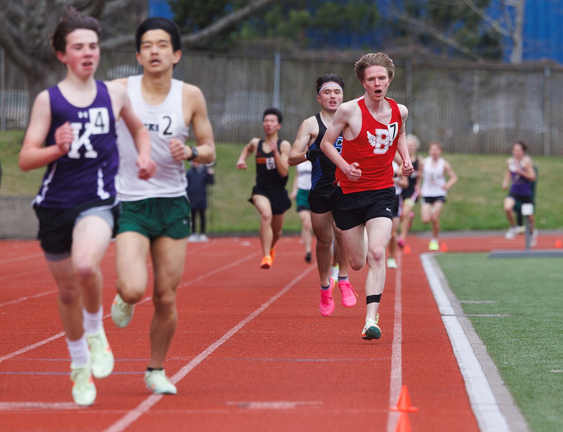 Bellingham's Gavin Miner, right, takes third in his heat of the boys 1600-meter run.