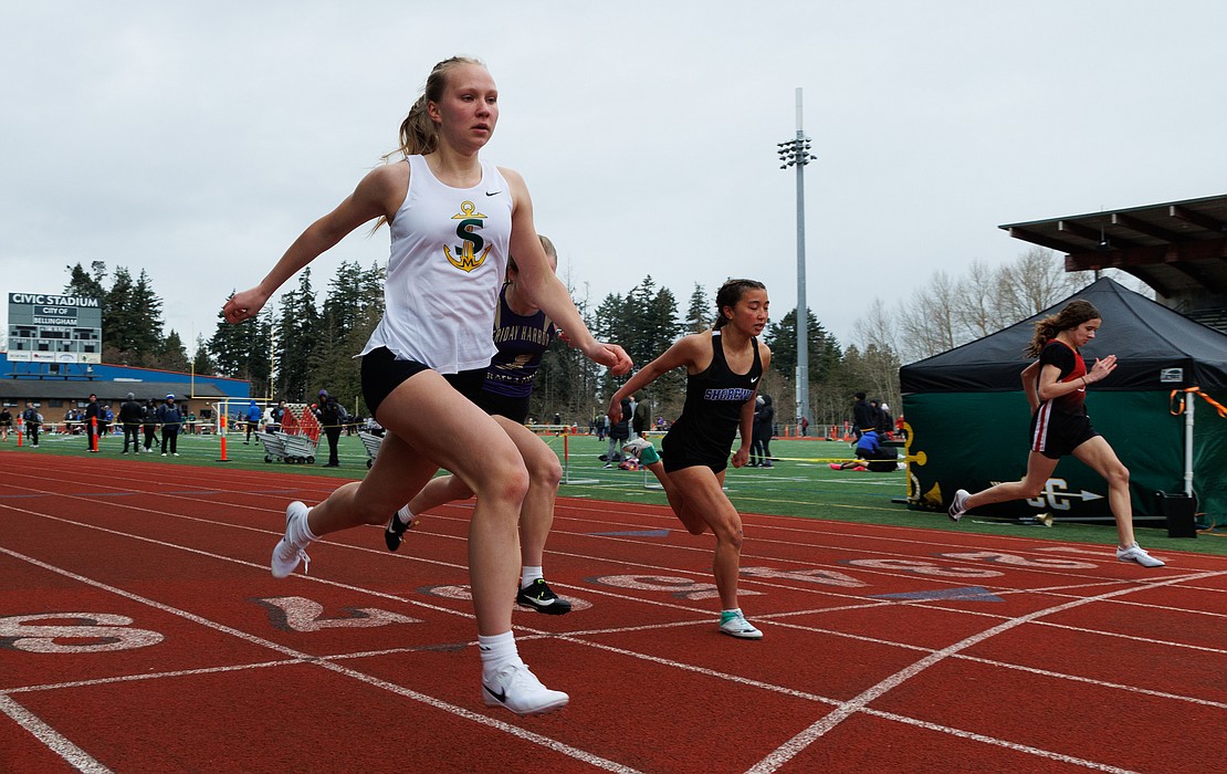 Sehome’s Alina Kravtsov crosses the finish line in first place in her heat of the girls 100-meter dash.