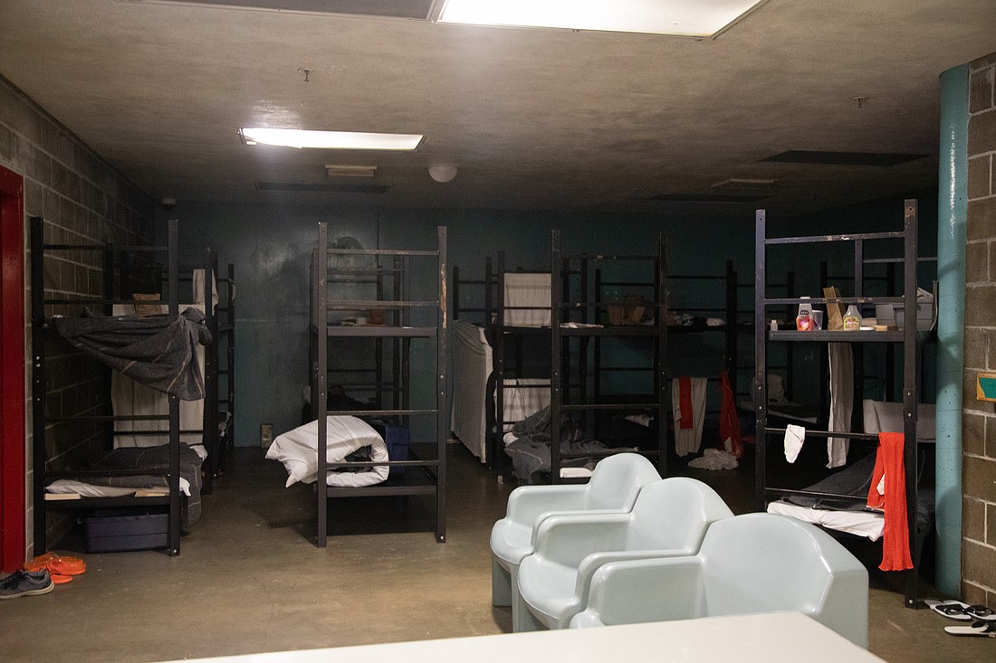Around a dozen inmates sleep and live in a windowless room that was once the indoor recreation space at the Whatcom County Jail.