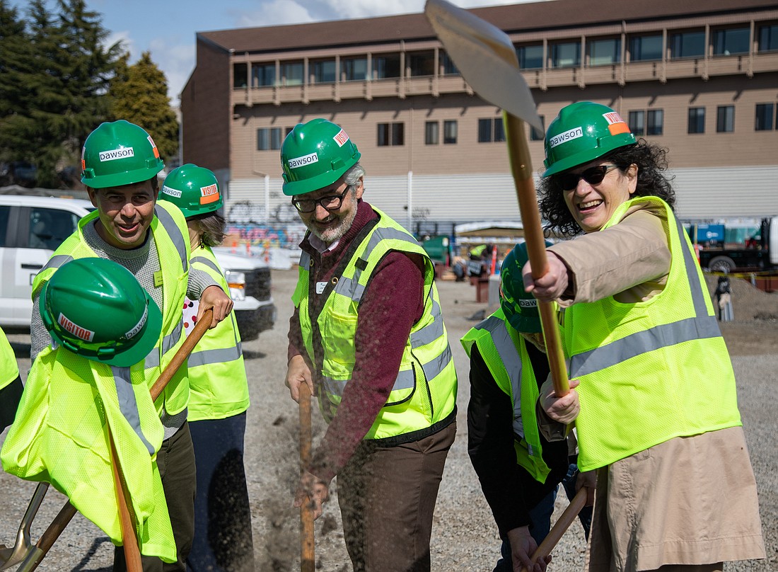 From left, Port of Bellingham commissioner Michael Shepard, Mercy Housing President Joe Thompson and Claire Petersky of the Washington State Housing Finance Commission ceremonially break ground for the Millworks project with golden shovels April 14.