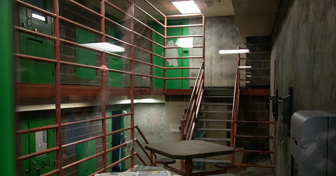 A cell in the Whatcom County jail leads to individual rooms. The jail lacks natural light and space for inmates to roam.