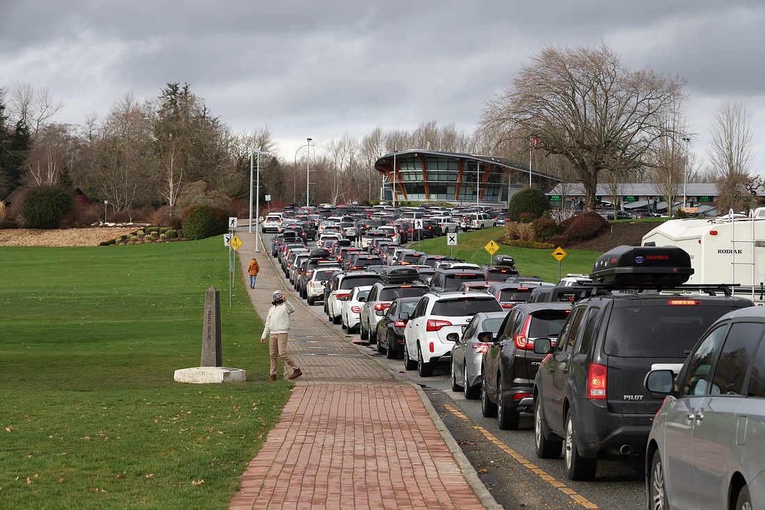 Lines of cars wait to cross the border in Blaine in February 2022. A nationwide labor strike in Canada is not expected to affect border travel, border services officials say.