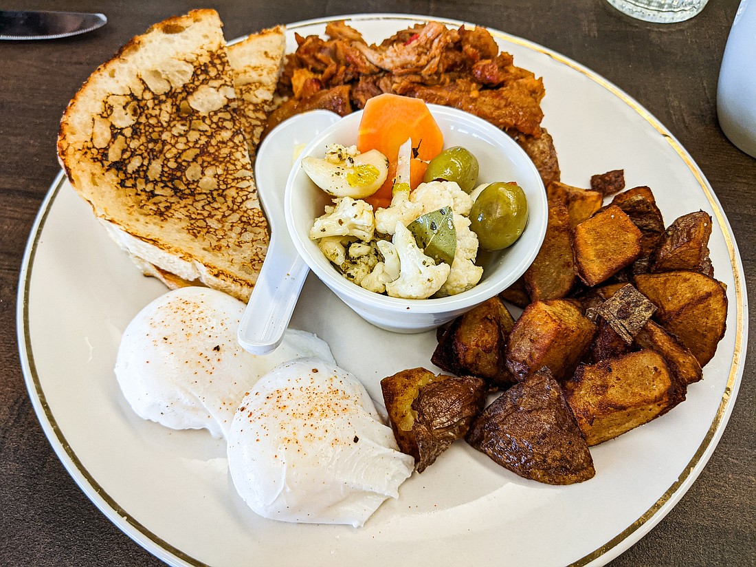 The “Brookefeast” plate at Martini Brunch — a new enterprise from Charlie and Brooke Martin in Mount Vernon — is an almost-classic-diner breakfast of eggs, sourdough toast and fried potatoes. It adds a large dollop of spicy pulled pork and a bowl of giardiniera (Italian pickled vegetables).