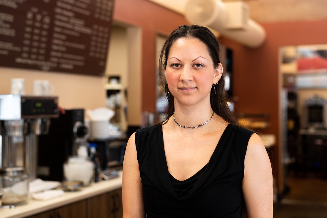 Dianna Del Giorgio stands behind the counter of Caffé Adagio. She has owned and worked at the cafe, located at 1435 Railroad Ave., since 2006.