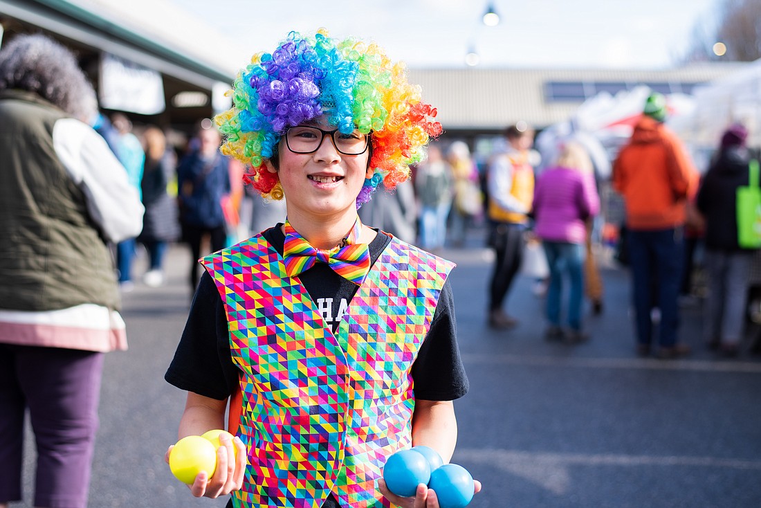 Owen Scollon holds his juggling balls April 1 at the Bellingham Farmers Market. He has also juggled at the Anacortes and Snohomish farmers markets, a Fourth of July parade and the Seattle Center.