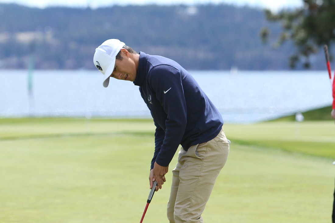 Western Washington University senior Jordan Lee lines up a putt during the final round of the men's golf GNAC tournament April 25 in Coeur d'Alene, Idaho. Lee won the individual title, notching his third-straight tournament win.