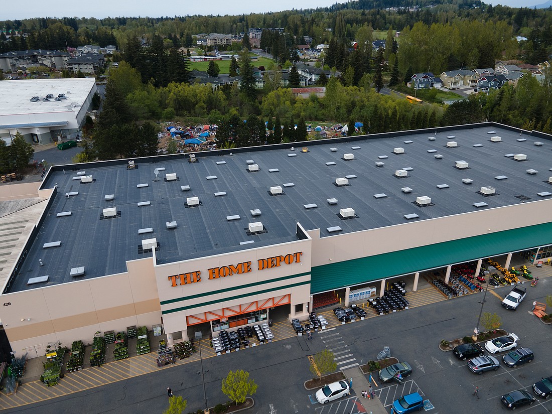 A homeless encampment is visible behind the Home Depot in Bellingham on May 4. City officials say an organized crime ring operates at the camp, targeting Home Depot and other nearby retailers. The home improvement store hired armed security about a year ago to reduce theft.