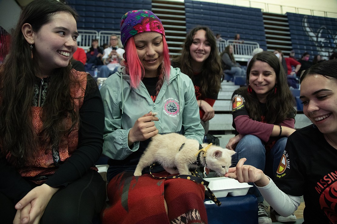 Northwest Indian College student Kristen Peel and her 8-week-old kitten Caesar Zeppelin are surrounded by Western Native American Student Union students, from left, Maiyu Nanouk Jones, Evan Peone, Hayley Abella and Laraya Johnson, prior to the start of the Coastal Jam.