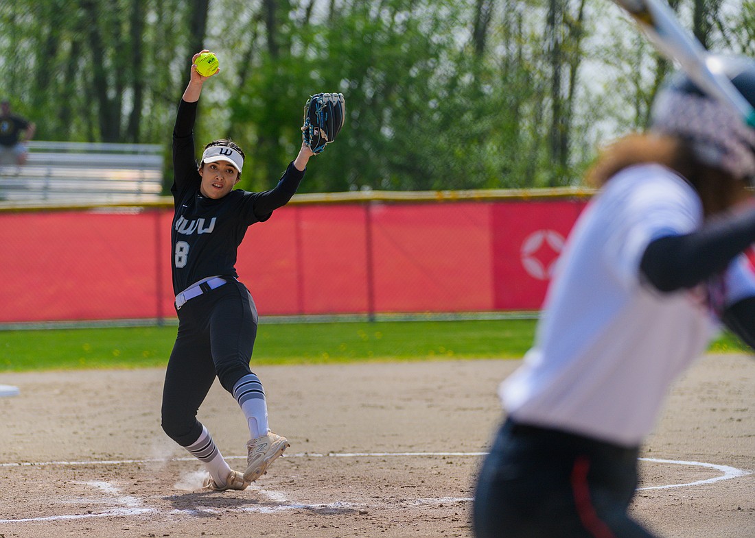 Western Washington senior Mareena Ramirez winds up to deliver a pitch to a Saint Martin's hitter May 4 during the Vikings' 12-4 loss to the Saints in the first round of the Great Northwest Athletic Conference tournament at Simon Fraser University.