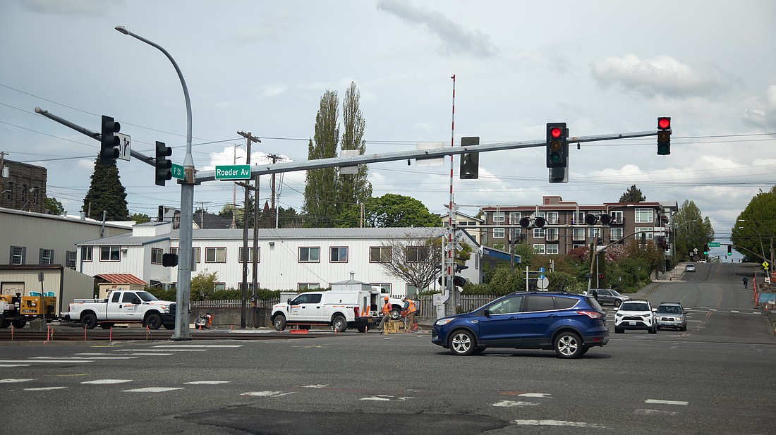 A crew prepares to make improvements to the railroad crossing at F Street and Roeder Avenue in Bellingham on May 8. The crossing is one of six in the city that are being upgraded, so Bellingham's waterfront area can receive quiet-zone status for passing trains.