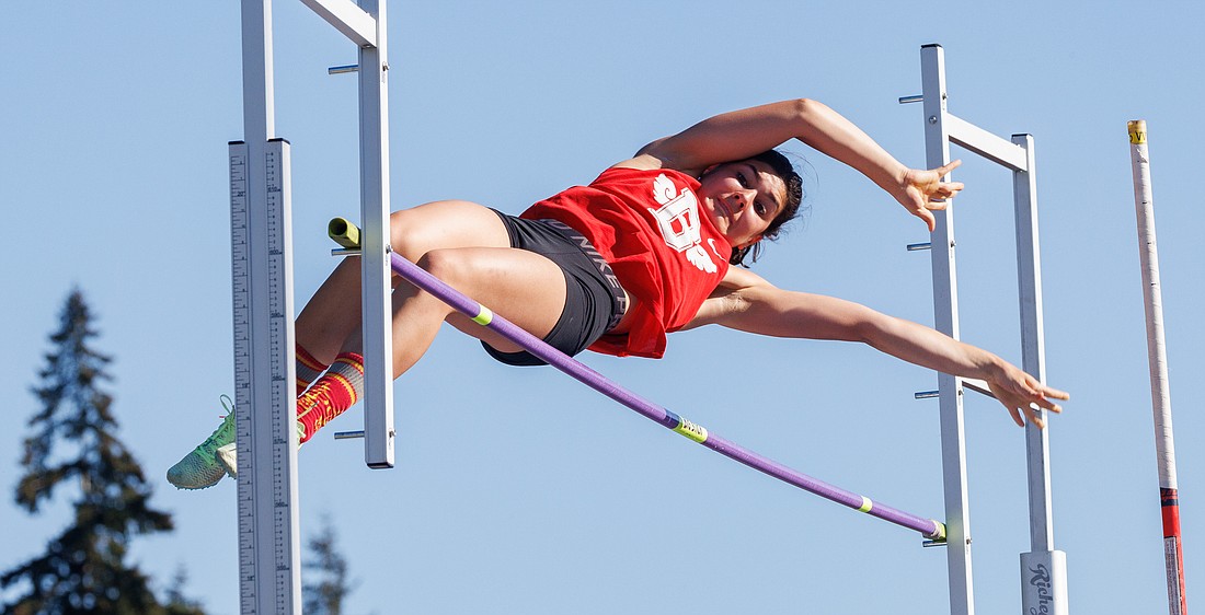 Bellingham's Calla Young clears the bar at 9-foot-10 to win the pole vault event May 12 at the 2A District 1 North Sub-District track meet in Bellingham.
