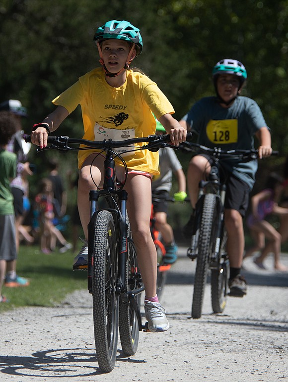 Ella Flaig of the Speedy Cheetahs races on bike in the elementary division.